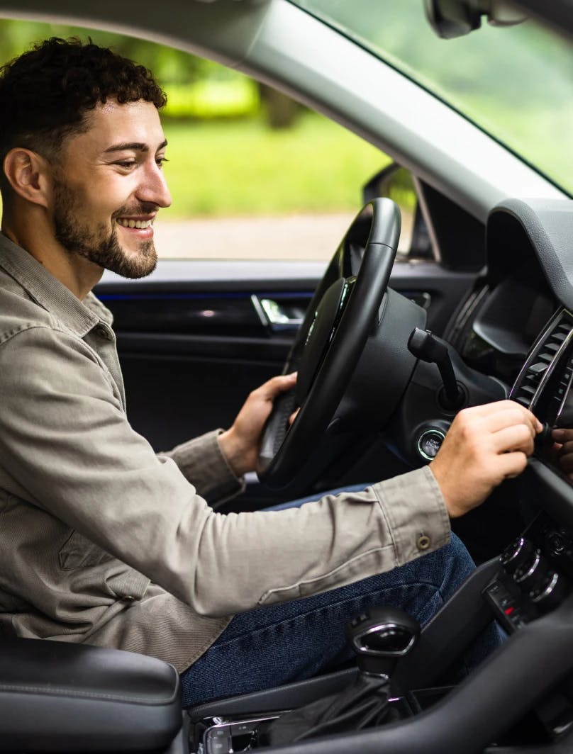 Man using his car air vents